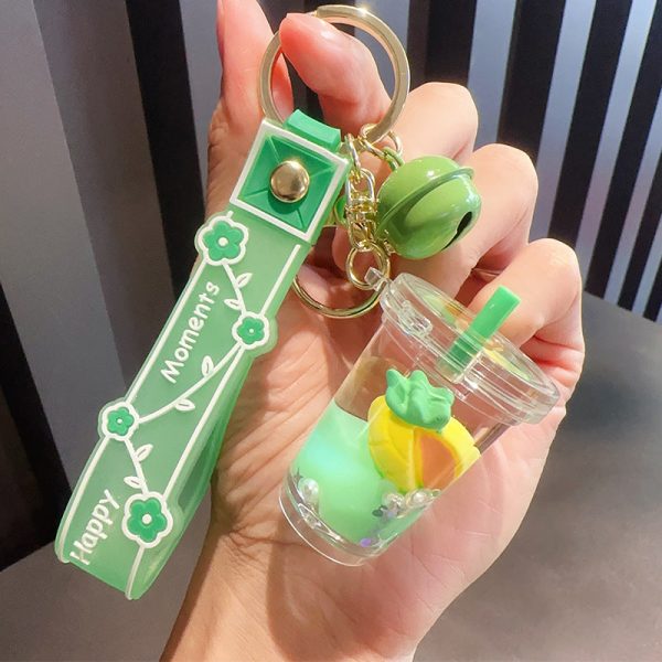 Wholesale Creative Green Fruit in Oil Floating Quicksand Drift Bottle Acrylic Keychain Supply