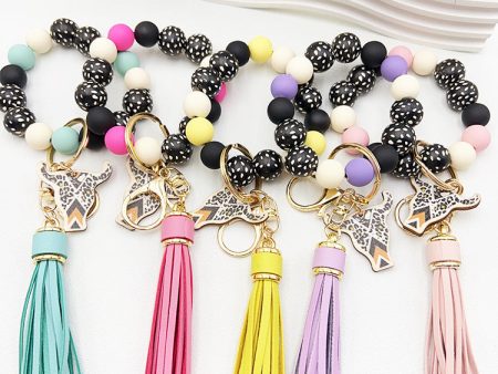 Wholesale Wooden Ox Head Sesame Spotted Wooden Beads PU Tassel Wrist Keychain Hot on Sale